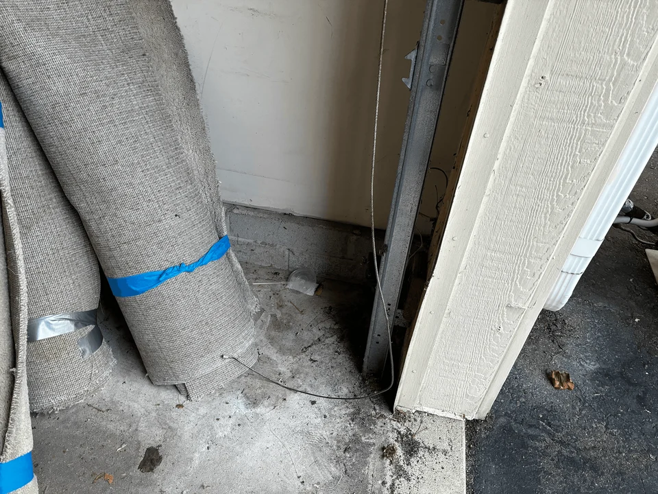 Broken garage door cable before replacement