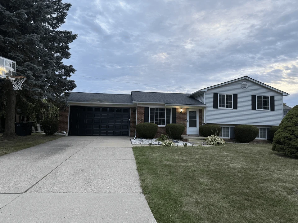 Dark replacement garage door on a residential home from the GarageCraft project gallery