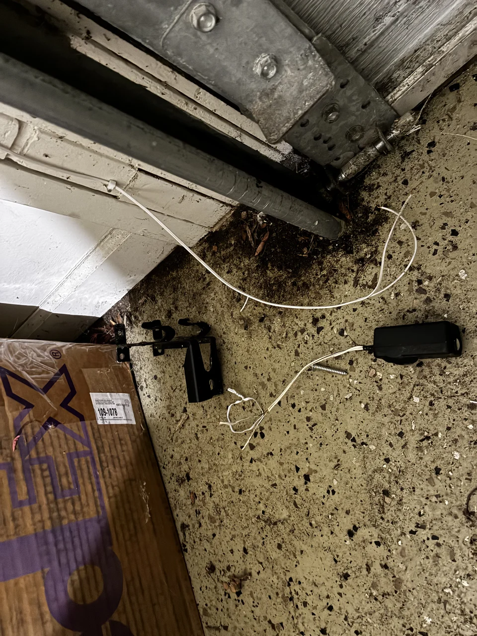 Broken garage door safety sensor