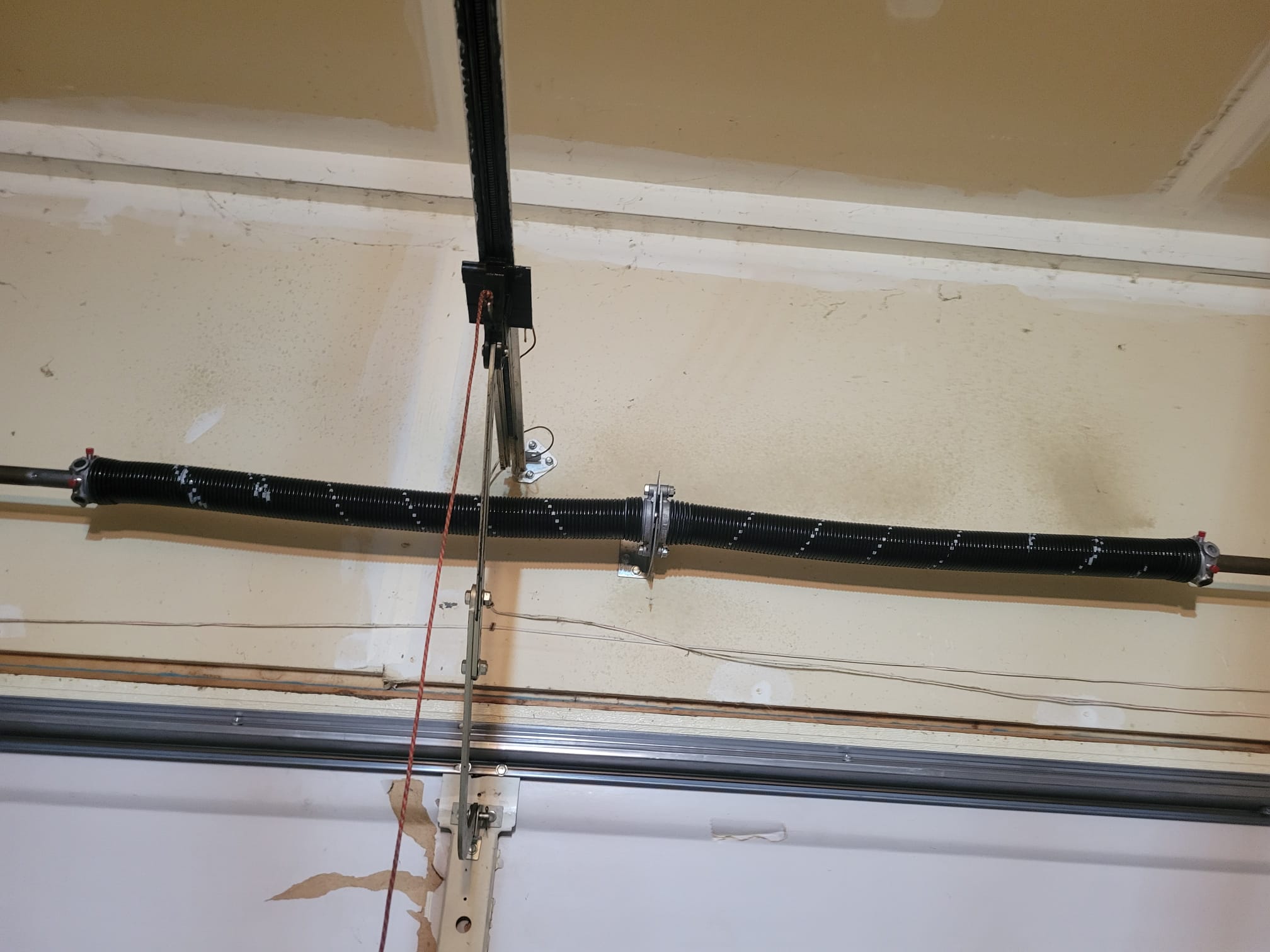 New garage door spring installed and working properly