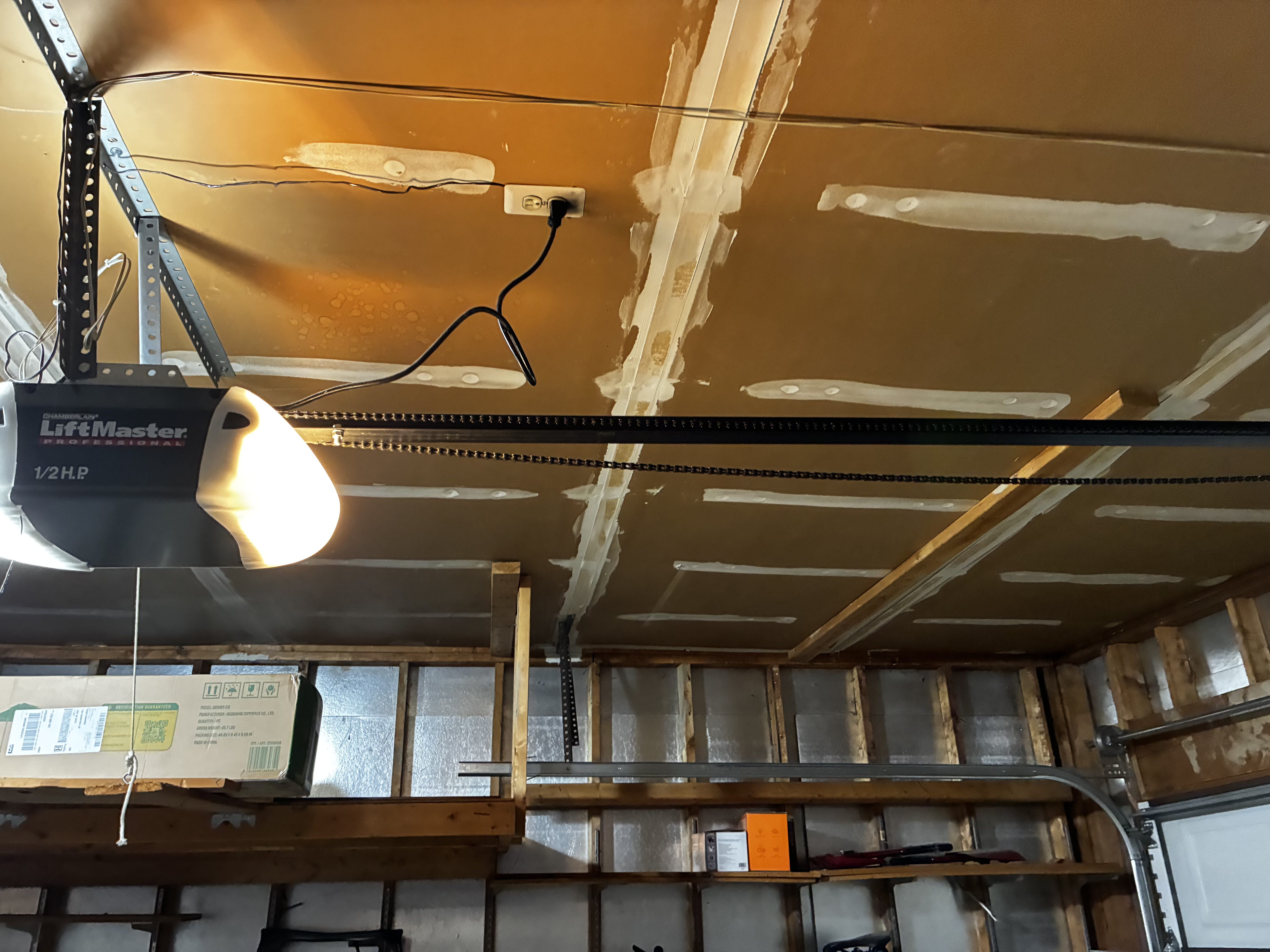 Loose garage door opener chain before adjustment